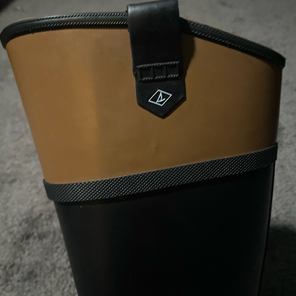 Black and brown Sperry rain boots